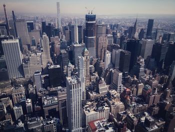 High angle view of modern buildings in city against sky