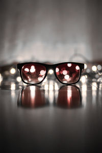 Close-up of sunglasses on table