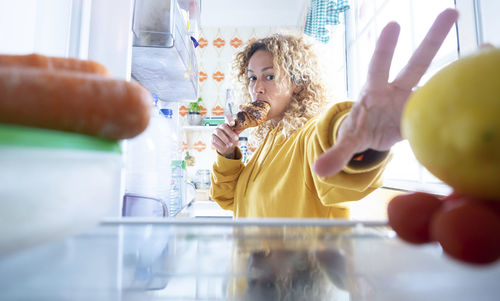 Midsection of scientist examining chemical in laboratory