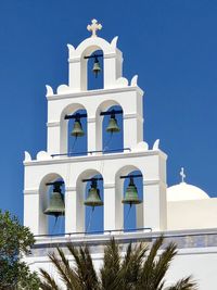 Low angle view of white building against blue sky