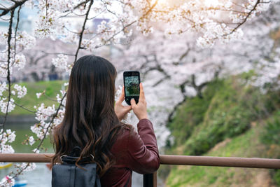 Young woman using mobile phone