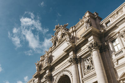 Low angle view of historical building against cloudy sky