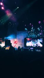 Rear view of people enjoying music concert