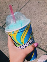 Close-up of hand holding ice cream