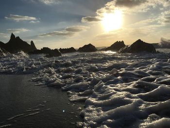 Scenic view of sea against sky at sunset