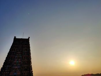 Low angle view of silhouette buildings against sky during sunset