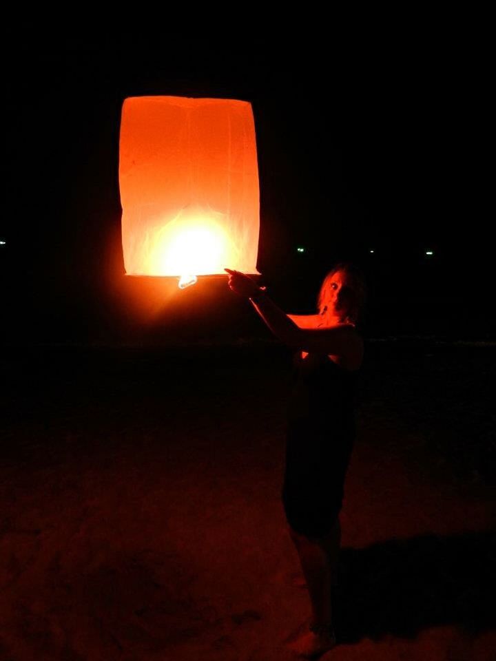 illuminated, red, indoors, night, orange color, lifestyles, copy space, standing, dark, holding, full length, men, leisure activity, lighting equipment, sunset, burning, silhouette, glowing