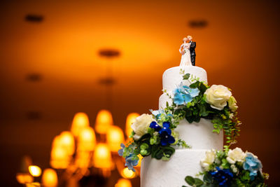 Wedding cake with bride and groom couple figurine and flower