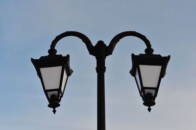 Low angle view of street light against sky