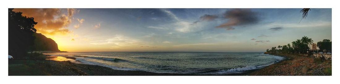 Panoramic view of sea against sky during sunset