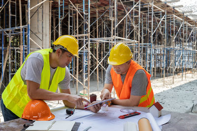 Side view of man working at construction site