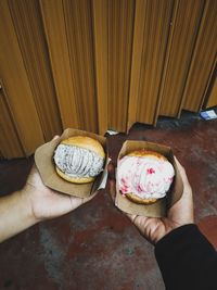 High angle view of hand holding ice cream