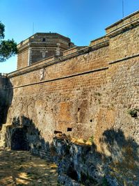 Low angle view of fort against clear sky