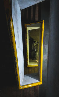 Close-up of yellow window on building