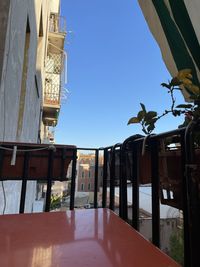 Low angle view of building against clear blue sky