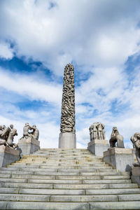 Low angle view of steps leading to sculpture