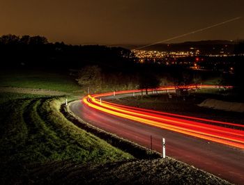 Light trails on road at night