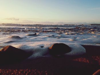 Scenic view of sea at sunset