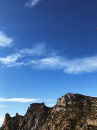 Low angle view of rock formations against sky