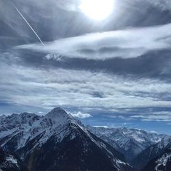 Scenic view of snowcapped mountains against sky