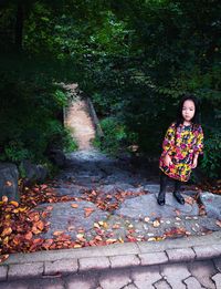 Full length of woman in park during autumn