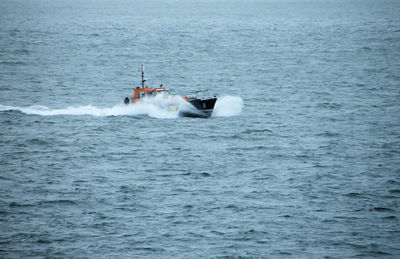 Boat sailing in sea