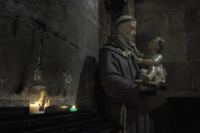 Statue against wall in building