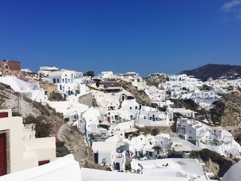 High angle view of houses against clear sky during winter