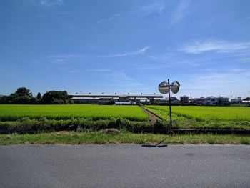 Road sign against sky