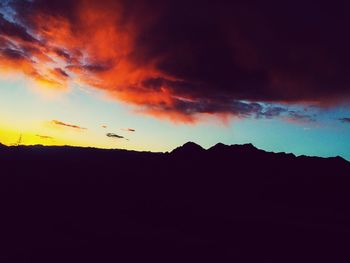 Low angle view of silhouette birds flying against sky during sunset