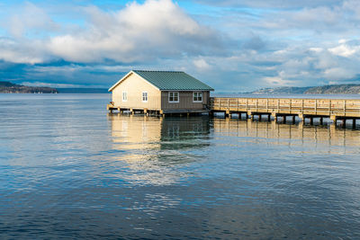 A view of the pier at redondo beach in washington state. the tide is high.