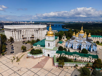 High angle view of buildings against cloudy sky