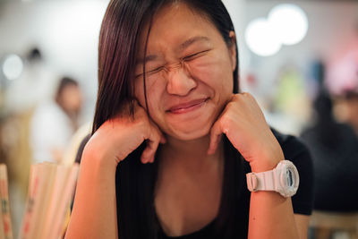 Close-up smiling woman with eyes closed