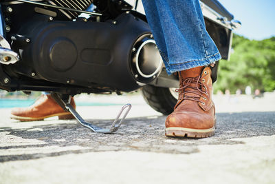 Low section of woman wearing shoes