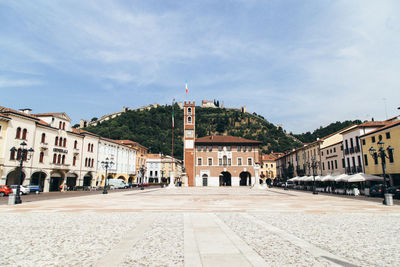 Buildings in city against sky