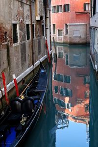 High angle view of canal amidst buildings