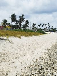 View of beach against cloudy sky