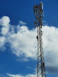 Low angle view of communications tower against sky