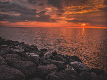 Scenic view of sea against sky during sunset