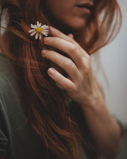 Close-up of woman with flower in hair