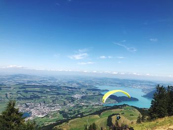 Scenic view of landscape against blue sky