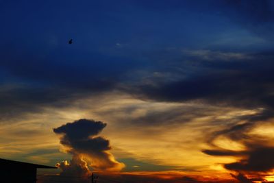 Low angle view of cloudy sky during sunset