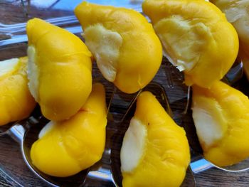 Close-up of yellow fruits on table, durian