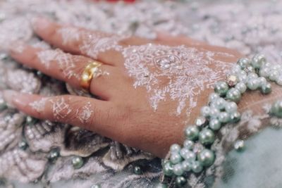 Close-up of woman hand holding flower bouquet