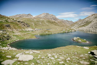 Scenic view of lake and mountains against sky