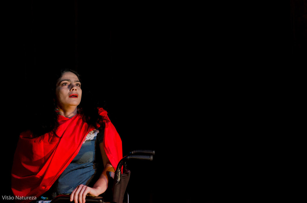 copy space, red, studio shot, one person, one woman only, only women, chair, black background, adults only, adult, people, women, indoors, one young woman only, young adult