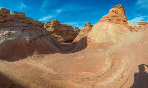 Panoramic view of rock formations against sky