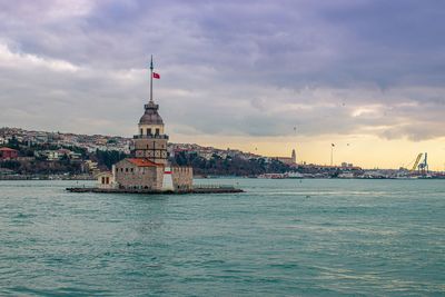 View of istanbul iconic building, maiden tower or kiz kulesi under a cloudy sky