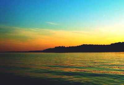 Scenic view of sea at sunset