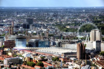 High angle view of modern buildings in city against sky